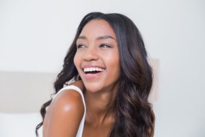 Woman laughing back over her shoulder