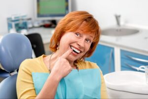 Smiling patient after dental implant treatment in Ukiah CA
